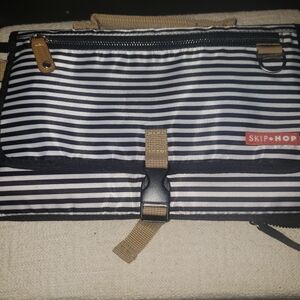 SKIP HOP MULTI FUNCTIONAL FOLD UP CHANGING PAD IN BLACK/ WHITE STRIPE PATTERN